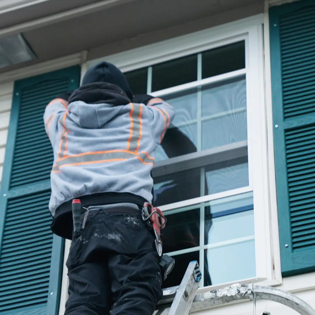Window installer retrofitting a window